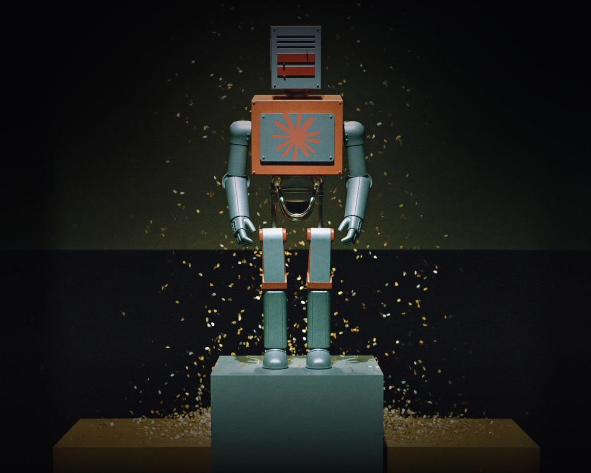 A robot standing on the top step of a podium under a spotlight
